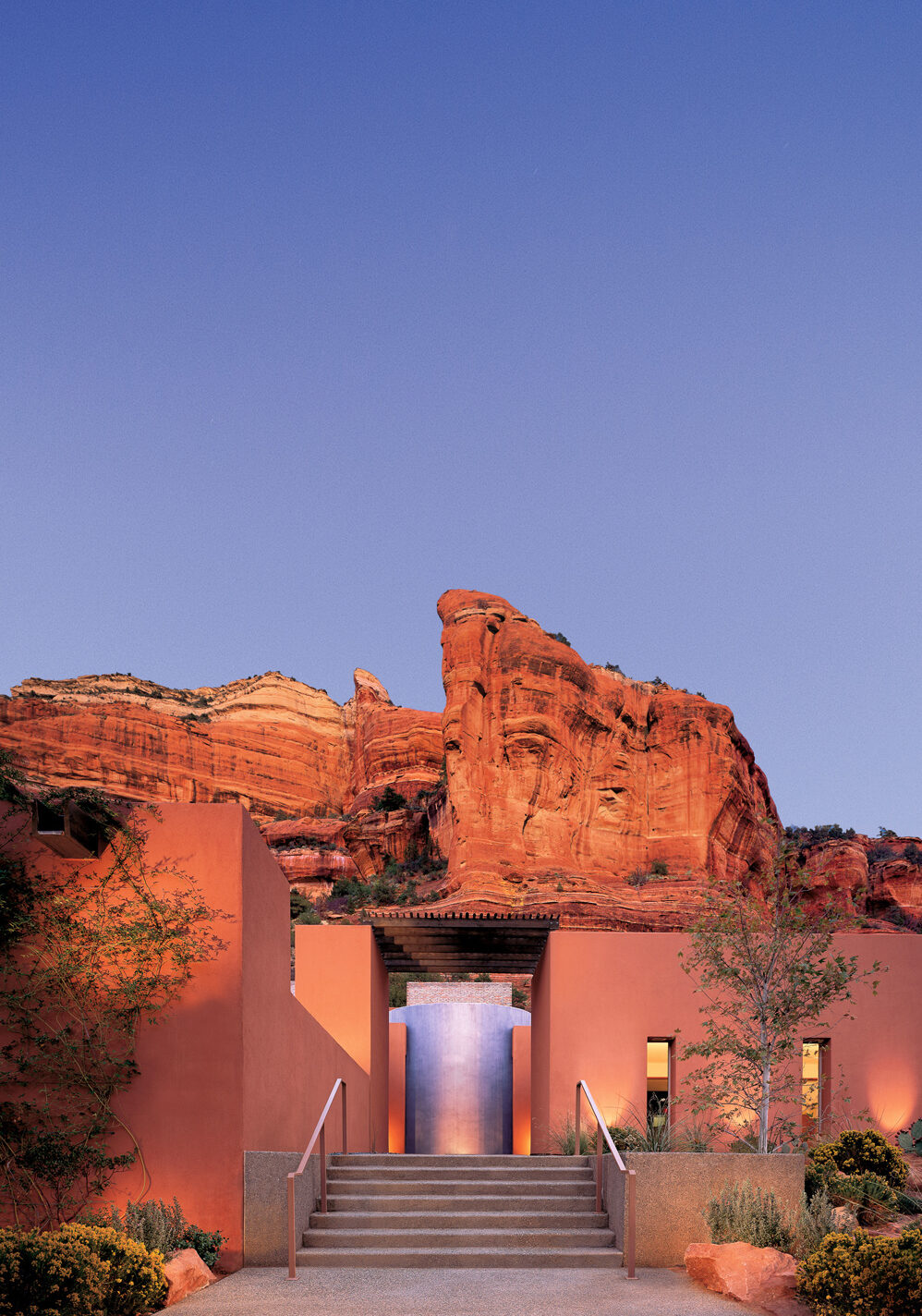 Mii amo entrance at dusk with red rocks of Sedona in background