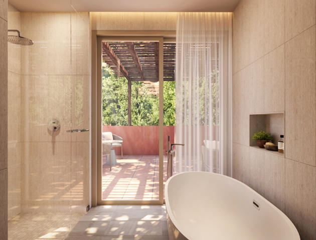 bathtub and glass shower in Mii amo Junior suite