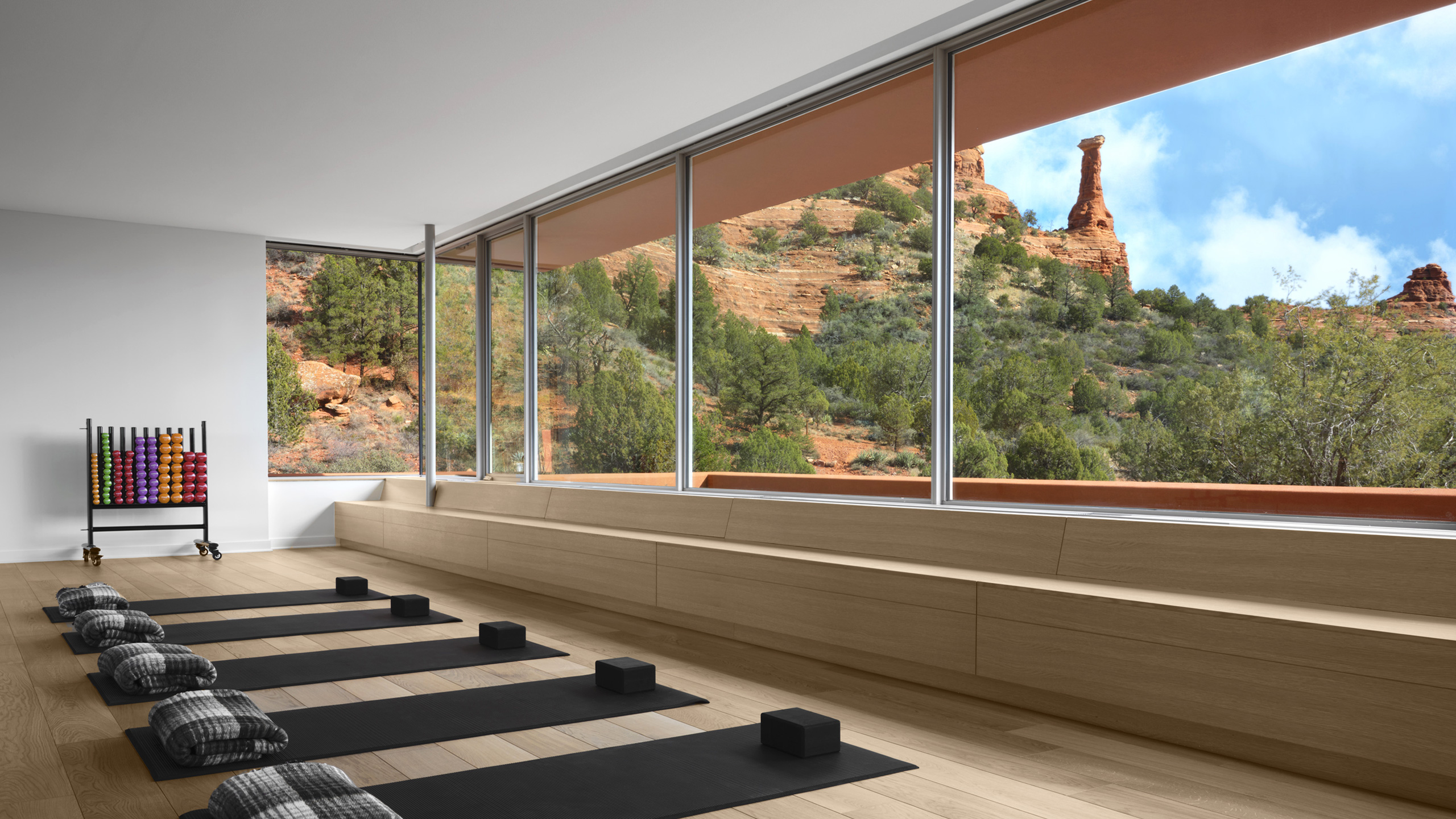 yoga mats lined up on floor with views of Kachina Women in Mii amo Fitness Studio