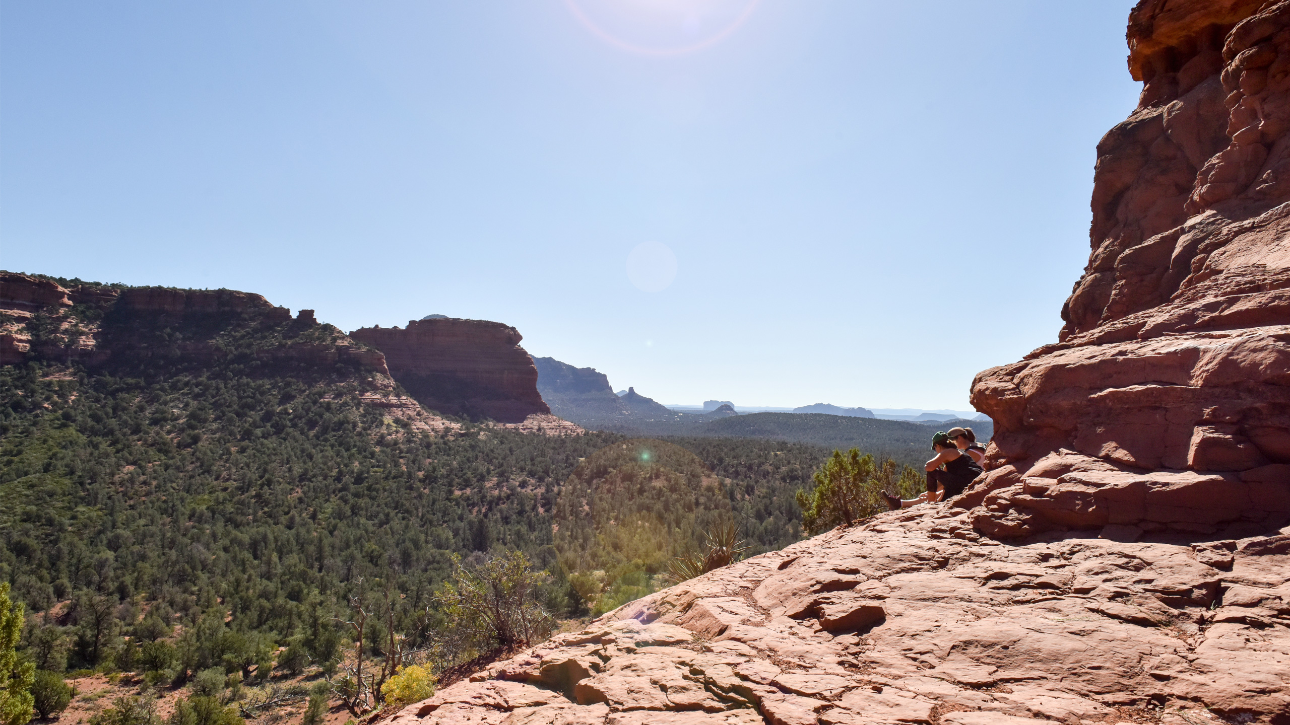 hikers sitting on trail in sedona
