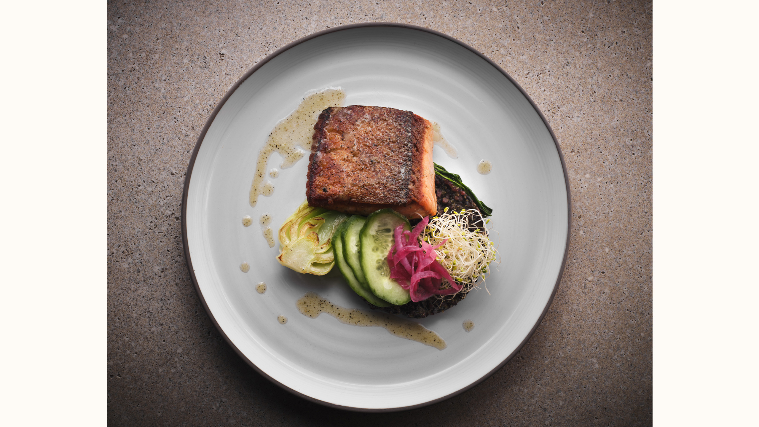 Salmon on plate with cucumbers and pickled onions served at our luxury Sedona spa