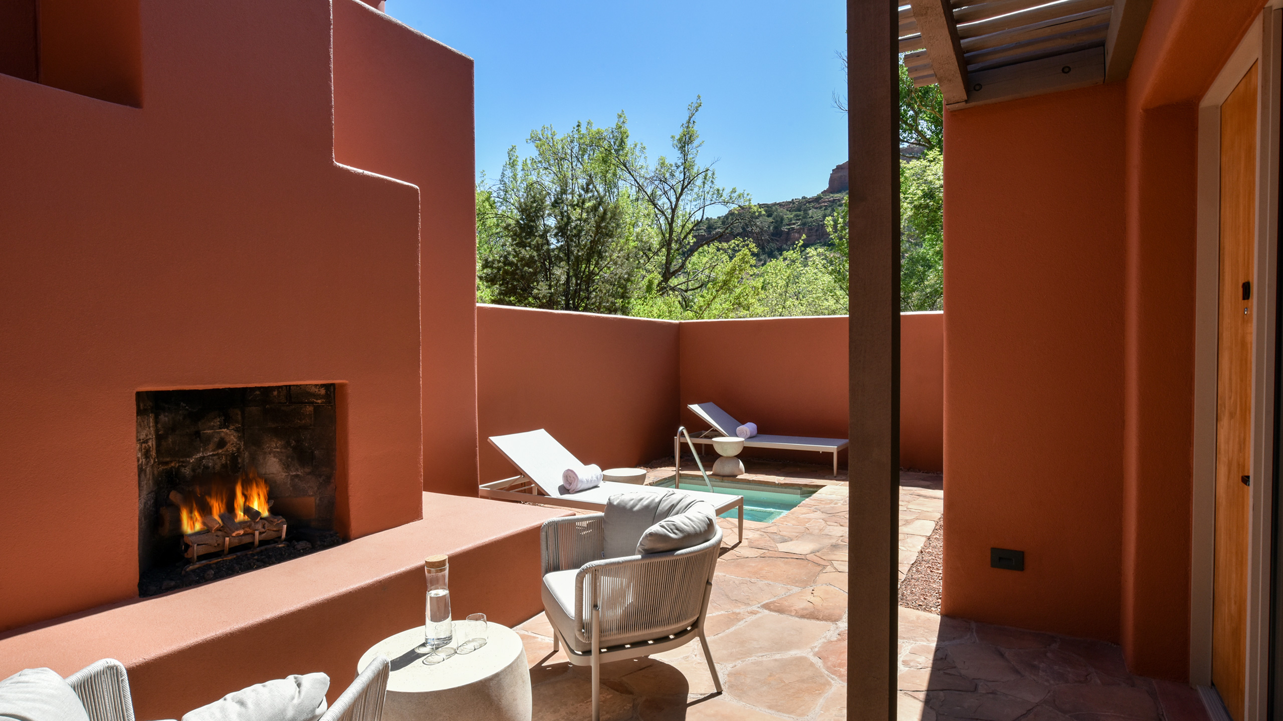 luxury suite courtyard with fireplace and spa pool